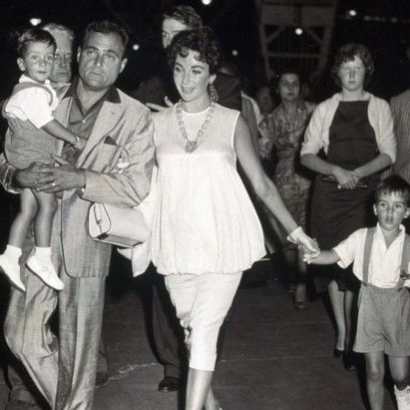 Elizabeth and Mike walking with their children